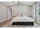 Spacious bedroom with king bed, wood floors, and an ensuite bathroom at 1136 Brick Rd, Winter Garden, FL 34787