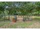Serene pond with wooden dock and lush landscaping at 1136 Brick Rd, Winter Garden, FL 34787
