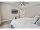 Main bedroom with king bed, TV, and access to ensuite bathroom at 1136 Brick Rd, Winter Garden, FL 34787