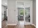 Home office with glass French doors and hardwood floors at 1136 Brick Rd, Winter Garden, FL 34787