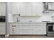 White kitchen cabinets and quartz countertops at 1136 Brick Rd, Winter Garden, FL 34787