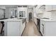 Modern kitchen with white cabinets and large island at 1136 Brick Rd, Winter Garden, FL 34787