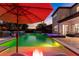 Inviting pool and spa area with colorful night lighting at 9424 Royal Estates Blvd, Orlando, FL 32836