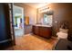 Bathroom with double vanity and tiled floors at 11430 Wishing Well Ln, Clermont, FL 34711