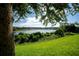 Peaceful lake view from a backyard at 11430 Wishing Well Ln, Clermont, FL 34711