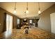 Kitchen with island, granite countertops, and pendant lighting at 11430 Wishing Well Ln, Clermont, FL 34711