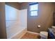 Clean bathroom with a bathtub, toilet, and vanity at 11430 Wishing Well Ln, Clermont, FL 34711