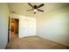 Bright bedroom with ceiling fan and double doors closet at 11430 Wishing Well Ln, Clermont, FL 34711