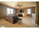Spacious living room with ceiling fan and neutral decor at 11430 Wishing Well Ln, Clermont, FL 34711
