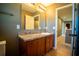 Bathroom with vanity, sink, and mirror at 11430 Wishing Well Ln, Clermont, FL 34711