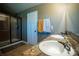 Bathroom with double vanity and a shower at 11430 Wishing Well Ln, Clermont, FL 34711