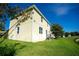 Exterior view of a two-story house with backyard at 11430 Wishing Well Ln, Clermont, FL 34711