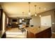 Open kitchen with breakfast bar and views to the living room at 11430 Wishing Well Ln, Clermont, FL 34711