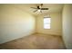 Bedroom with ceiling fan and window at 11430 Wishing Well Ln, Clermont, FL 34711