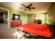 Spacious bedroom with king bed, dresser and TV at 11430 Wishing Well Ln, Clermont, FL 34711