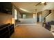 Open living area with a view of the kitchen and stairs at 11430 Wishing Well Ln, Clermont, FL 34711