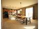 Eat in kitchen with island, modern appliances, and wood flooring at 11430 Wishing Well Ln, Clermont, FL 34711