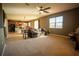 Open living area with a view of the kitchen and stairs at 11430 Wishing Well Ln, Clermont, FL 34711