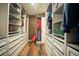 Spacious walk-in closet with ample shelving and drawers at 11430 Wishing Well Ln, Clermont, FL 34711