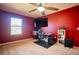 Bedroom with home office, ceiling fan and window at 11430 Wishing Well Ln, Clermont, FL 34711