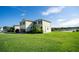 Two story house with a two car garage and pond view at 11430 Wishing Well Ln, Clermont, FL 34711
