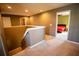 Upstairs hallway with view of bedroom and stairs at 11430 Wishing Well Ln, Clermont, FL 34711