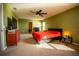 Bright bedroom with a king-size bed and TV at 11430 Wishing Well Ln, Clermont, FL 34711