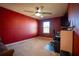 Bedroom with a home office setup and ceiling fan at 11430 Wishing Well Ln, Clermont, FL 34711