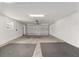 Spacious two-car garage with room for storage and workbenches at 11394 Zimmerman Path, Oxford, FL 34484
