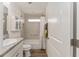Clean bathroom with tub shower and granite vanity at 11394 Zimmerman Path, Oxford, FL 34484