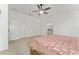 Main bedroom with ample closet space and carpeted floor at 11394 Zimmerman Path, Oxford, FL 34484