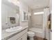 Bathroom with shower/tub combo and granite countertop at 11394 Zimmerman Path, Oxford, FL 34484
