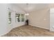 Bright dining room with vinyl flooring and large windows at 11394 Zimmerman Path, Oxford, FL 34484