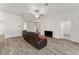 Bright living room featuring hardwood floors and a modern aesthetic at 11394 Zimmerman Path, Oxford, FL 34484