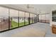 Spacious screened porch with ceiling fans and room for seating at 11394 Zimmerman Path, Oxford, FL 34484