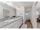 Double vanity bathroom with granite countertop at 11394 Zimmerman Path, Oxford, FL 34484