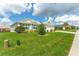 Landscaped yard showcasing the front of a single-story house at 11394 Zimmerman Path, Oxford, FL 34484