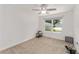 Bright bedroom with ceiling fan and window at 11394 Zimmerman Path, Oxford, FL 34484