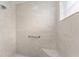 Large walk-in shower with built-in seat at 11394 Zimmerman Path, Oxford, FL 34484