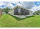 Well-maintained home with a screened porch and landscaped yard at 11394 Zimmerman Path, Oxford, FL 34484