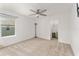 Bright bedroom with ceiling fan and window at 11394 Zimmerman Path, Oxford, FL 34484