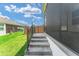 Concrete stairs leading up to a screened porch at 11394 Zimmerman Path, Oxford, FL 34484