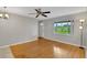 Spacious living room with hardwood floors and large window at 11635 Se Highway 42, Weirsdale, FL 32195