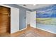 Serene bedroom with wood floors, ceiling fan and large closet at 11635 Se Highway 42, Weirsdale, FL 32195
