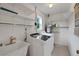Laundry room with washer, dryer, and utility sink at 11635 Se Highway 42, Weirsdale, FL 32195