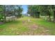 Large backyard with wooden fence and well at 11635 Se Highway 42, Weirsdale, FL 32195