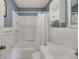 Clean bathroom with white vanity, tub shower combo, and white subway tiles at 11635 Se Highway 42, Weirsdale, FL 32195