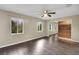 Bright bedroom featuring hardwood floors and a large closet at 11635 Se Highway 42, Weirsdale, FL 32195