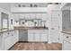 Open kitchen boasting granite counters and white cabinets at 3506 Mulberry Grove Loop, Leesburg, FL 34748