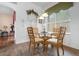 Charming breakfast nook with glass table and four chairs at 3506 Mulberry Grove Loop, Leesburg, FL 34748